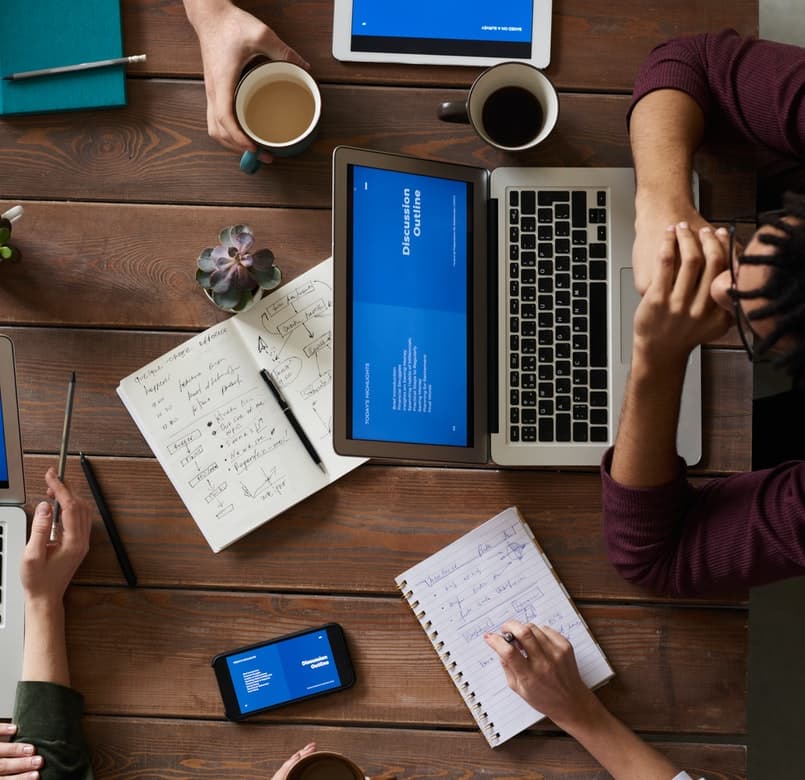 Workspace with laptop and notes